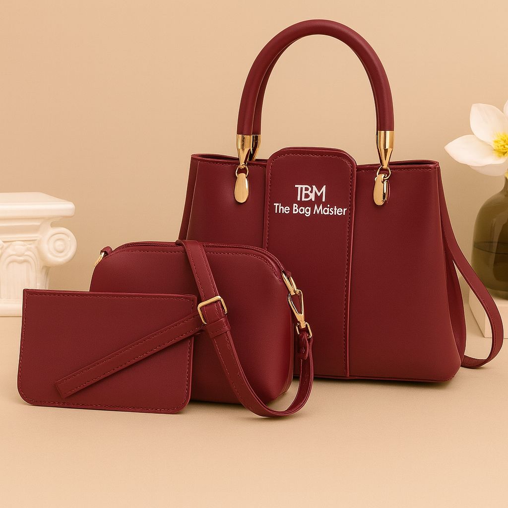 Red handbag and matching wallet with 'The Bag Master' logo on a beige background