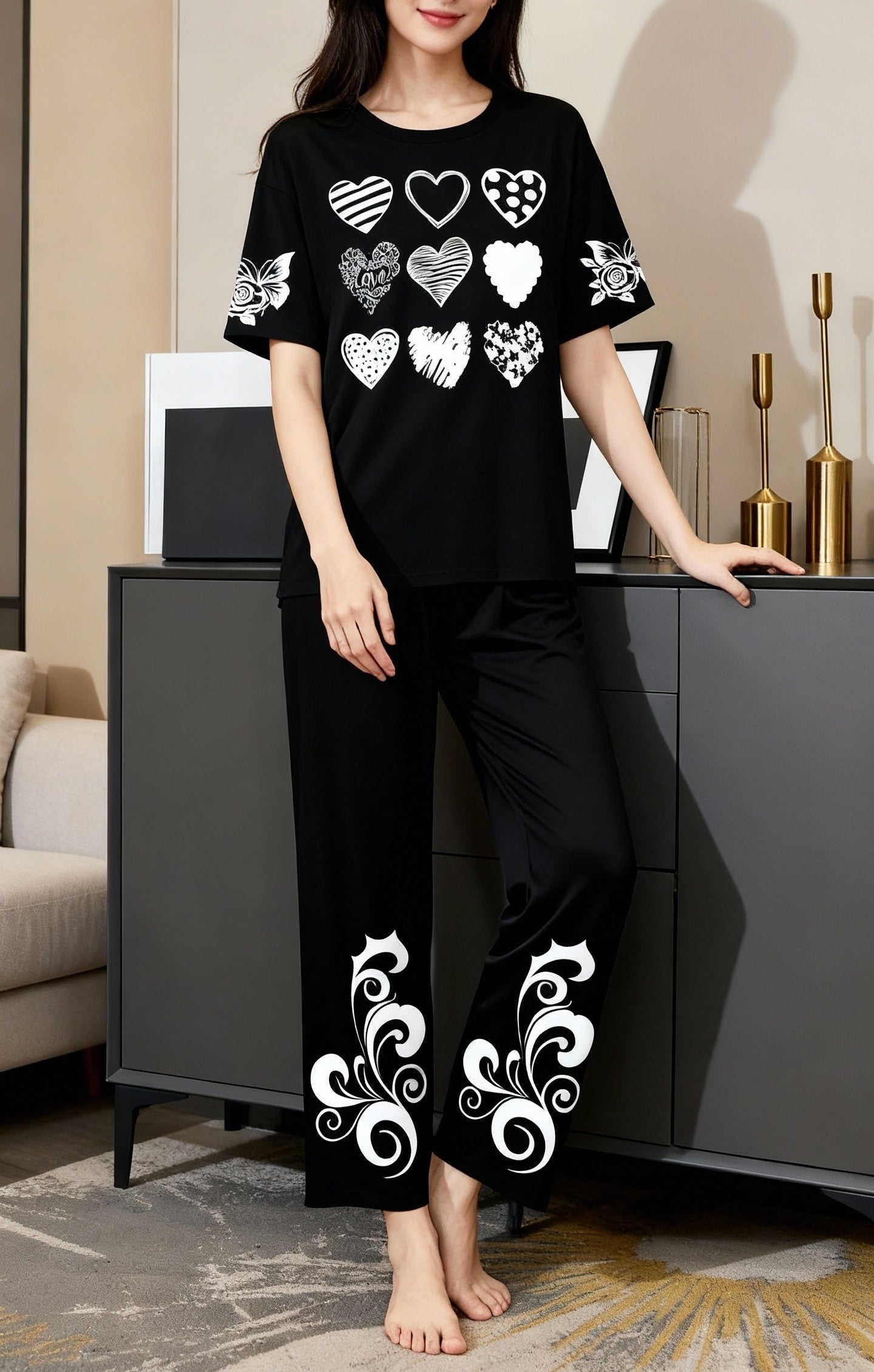 Woman wearing a black outfit with white patterns in a room.