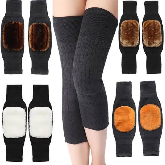 Knee-high socks with patch designs on a white background