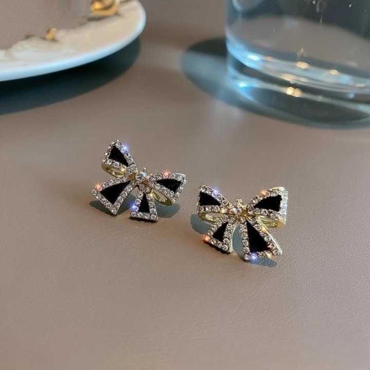Elegant Zircon Bow Shape Earrings in Black and White with Gold Finish by Trend-ify