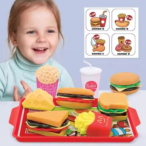 Child with toy fast food set and menu cards on a light blue background