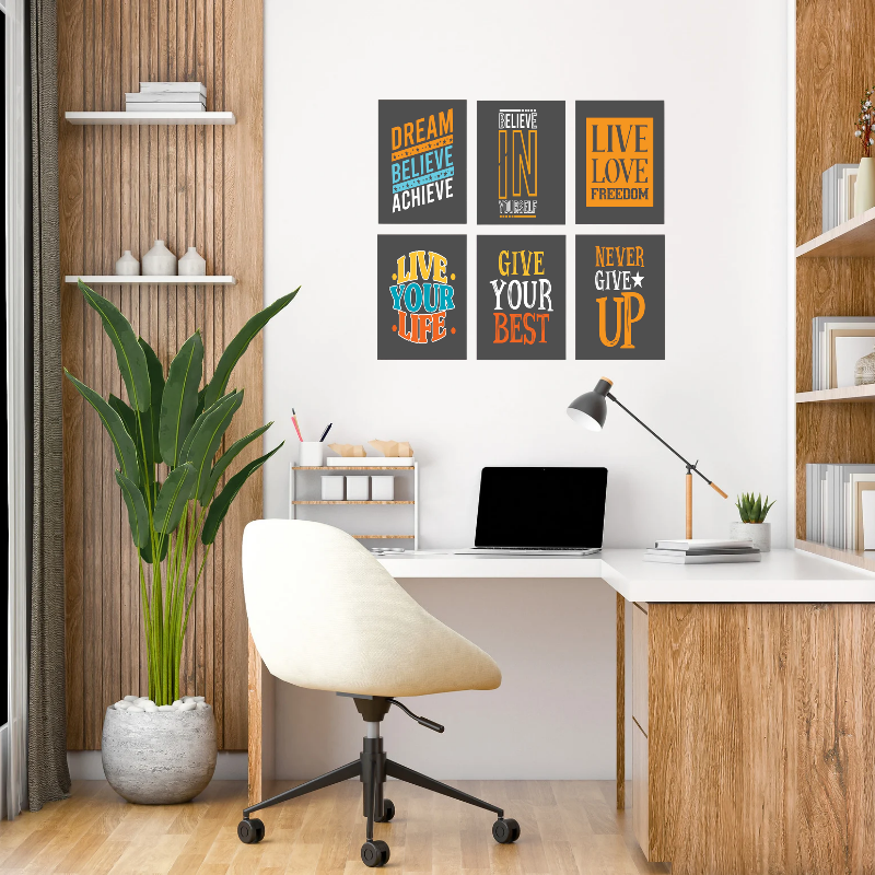 Modern home office with motivational posters on the wall, desk, chair, and plant.