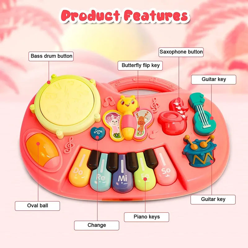 Children's toy piano with various buttons labeled on a pink background